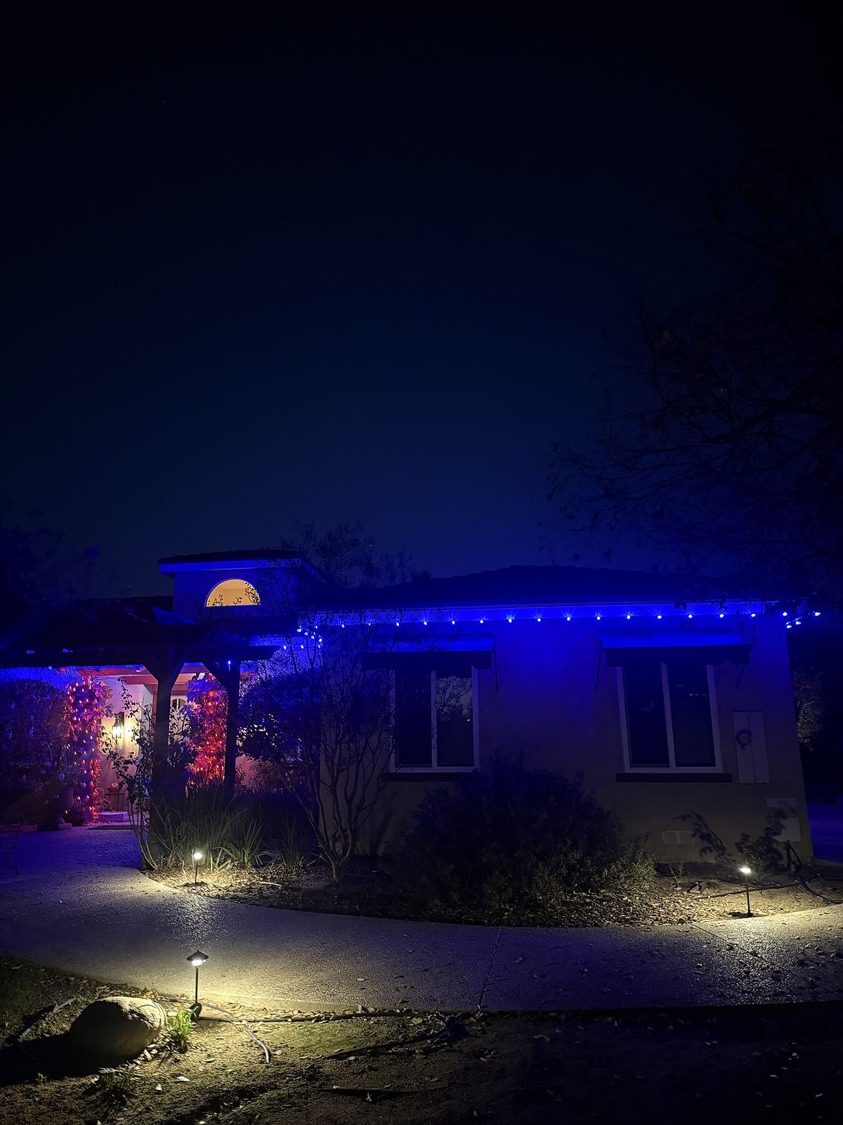 Single story blue icicle lights dusk — Christmas light installation in Riverside, CA