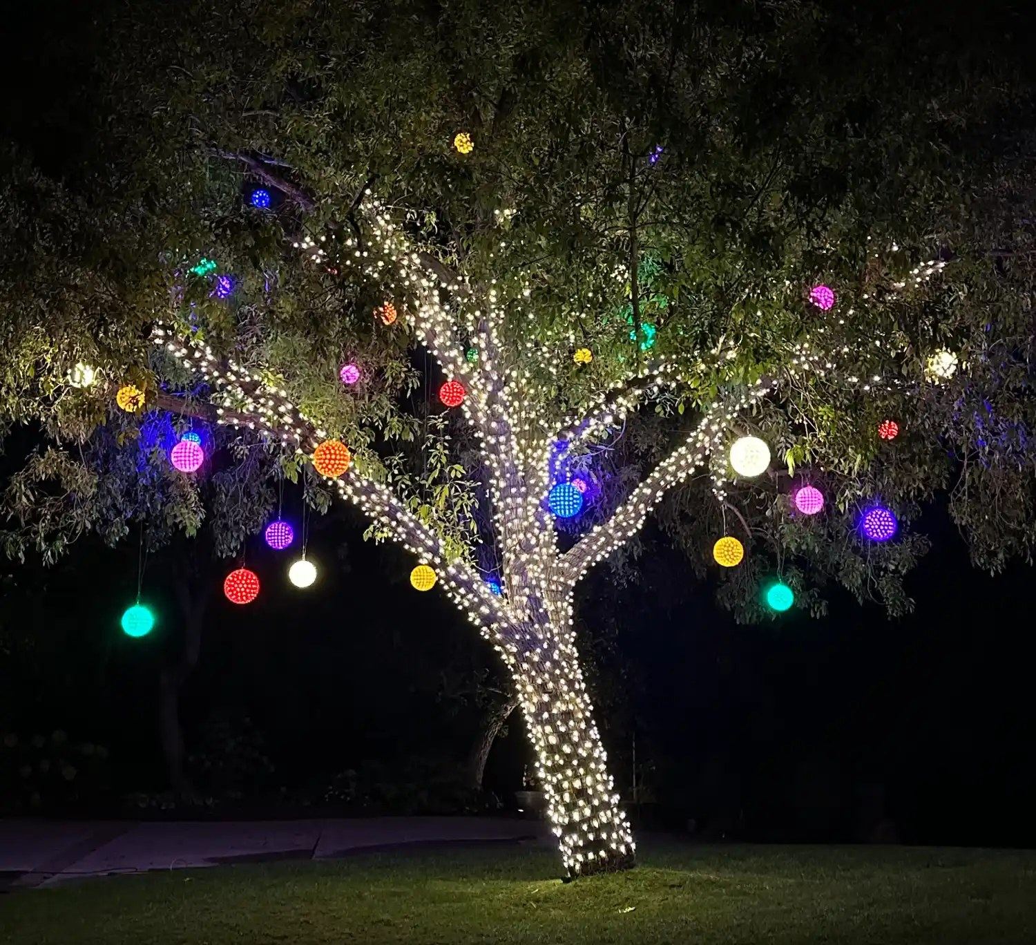 Tree wrap colorful ornament balls — Christmas light installation in Riverside, CA