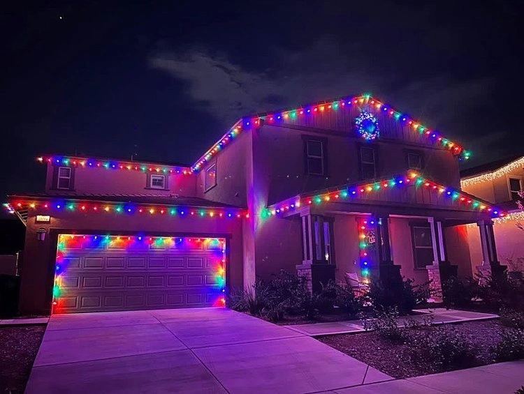 Two story rainbow colorful — Christmas light installation in Riverside, CA