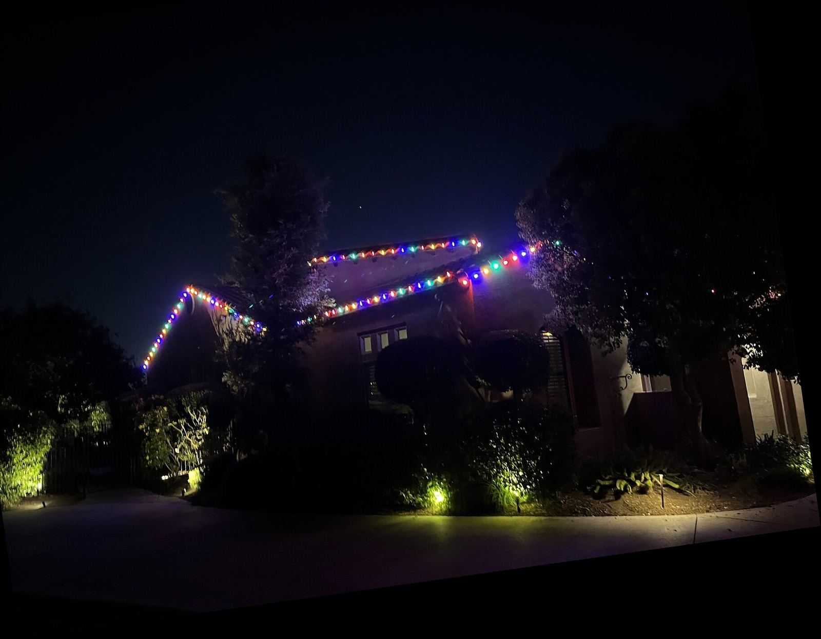 Two story rainbow multicolor trees night — Christmas light installation in Riverside, CA