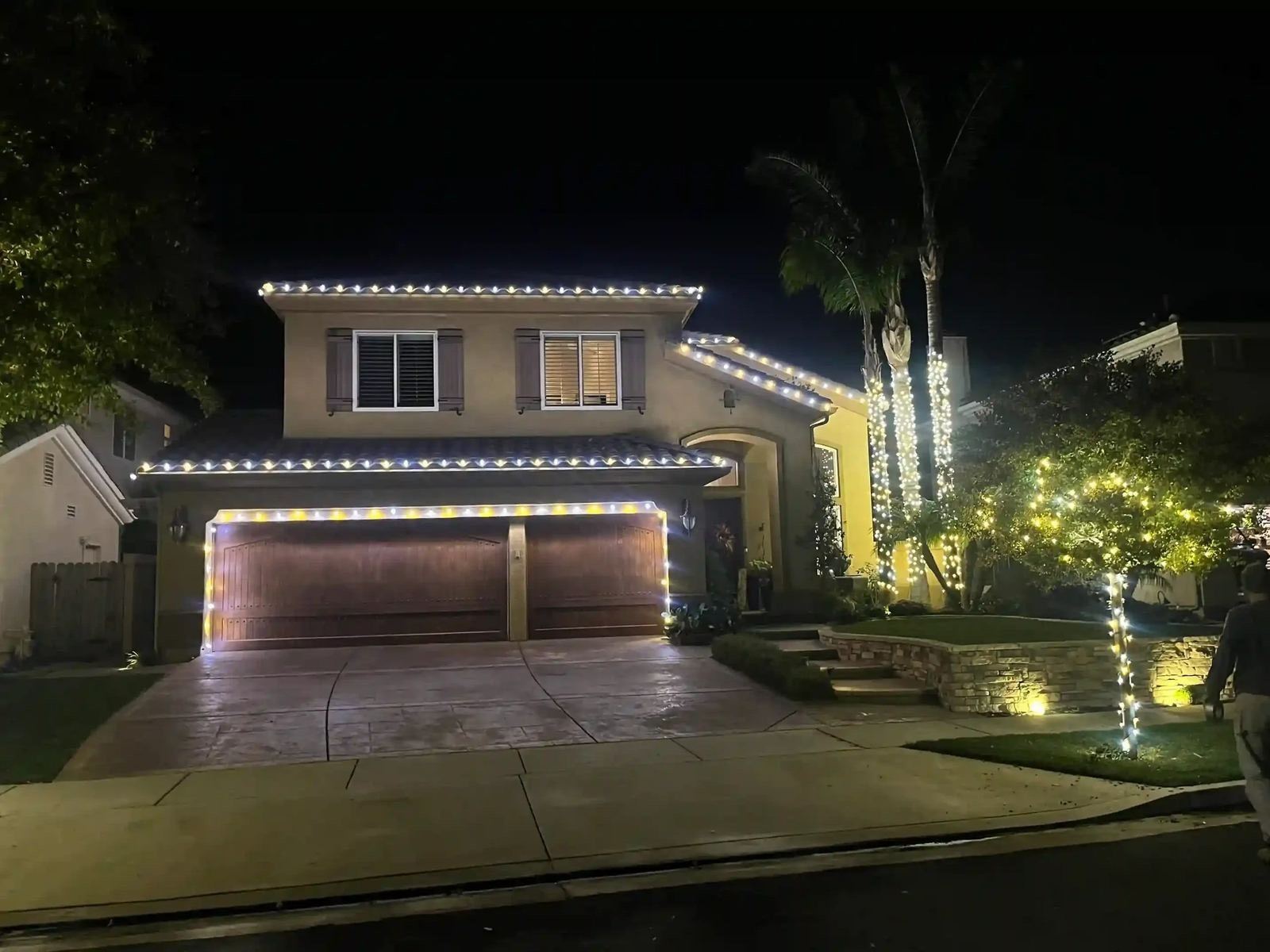 Two story wrapped palms — Christmas light installation in Riverside, CA