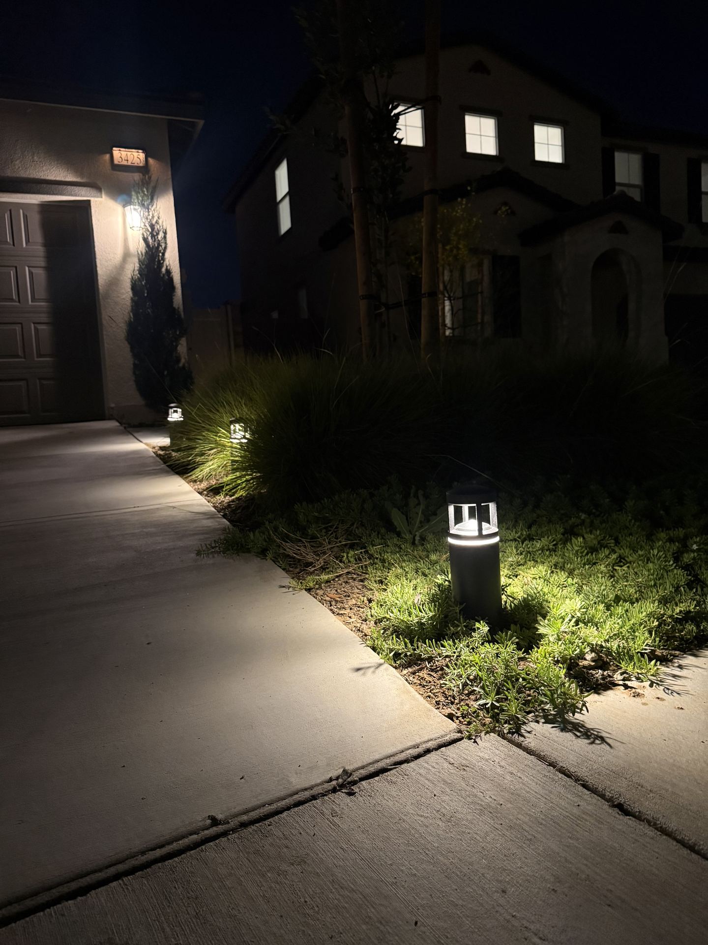 Bollard path lighting along driveway walkway — landscape lighting install in Riverside, CA