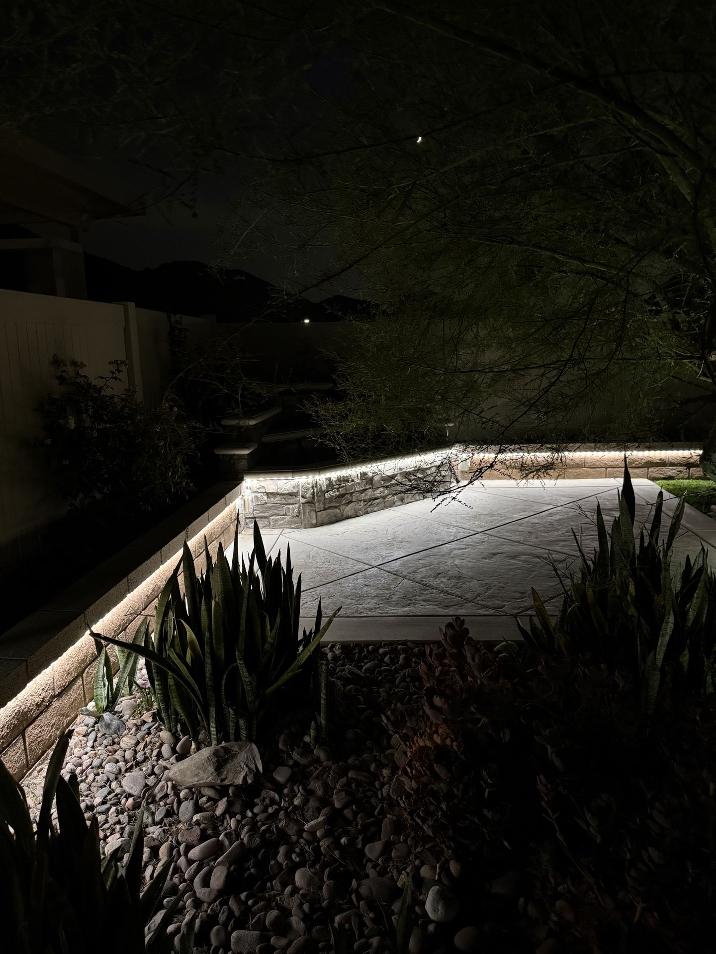 Retaining wall strip lighting along patio — landscape lighting install in Riverside, CA