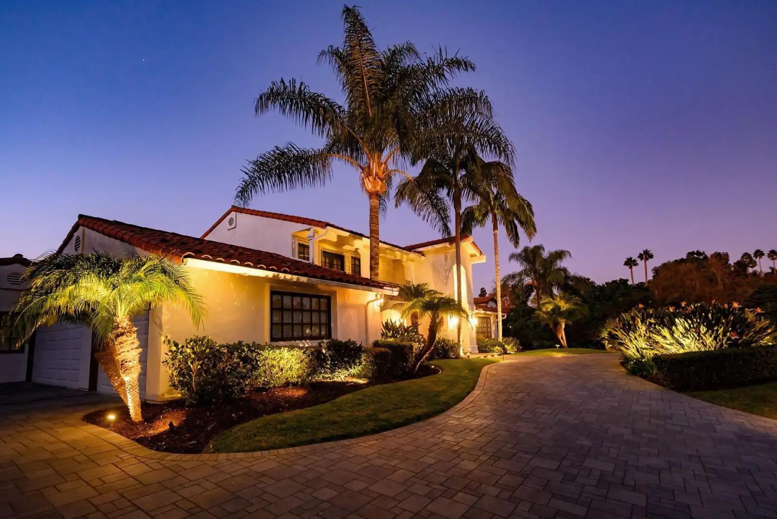 Spanish house palms dusk — landscape lighting install in Riverside, CA