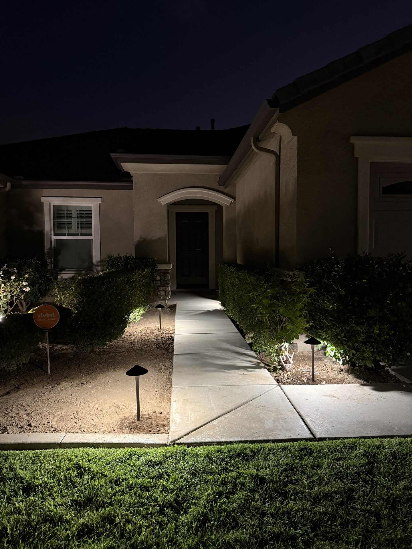 Walkway path lighting leading to front entry — landscape lighting install in Riverside, CA