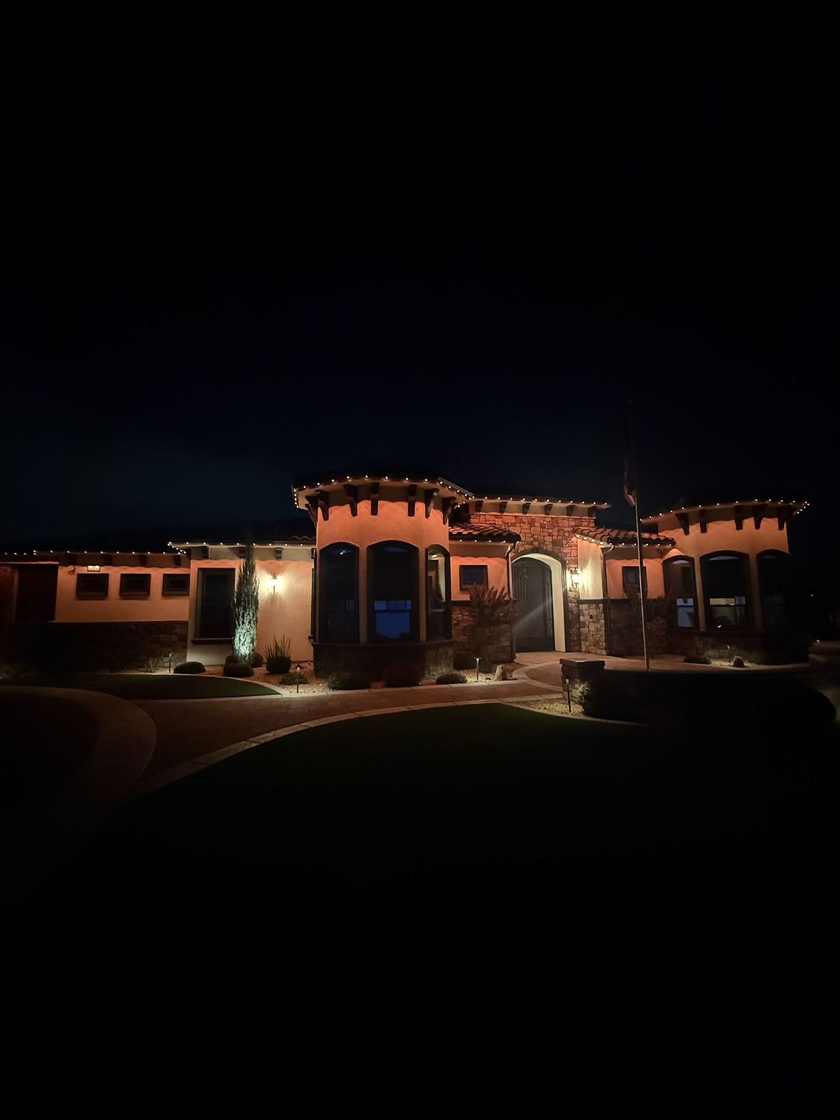 Mediterranean estate warm white night — permanent LED roofline lighting in Riverside, CA
