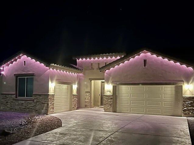 Single story pink lavender dusk — permanent LED roofline lighting in Riverside, CA