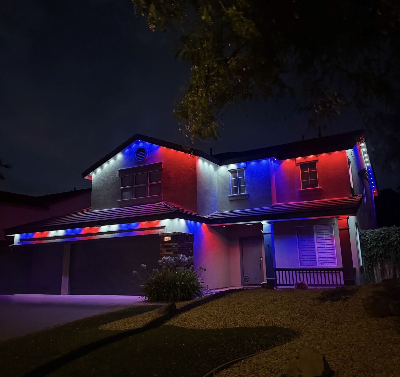 Two story patriotic red blue night — permanent LED roofline lighting in Riverside, CA