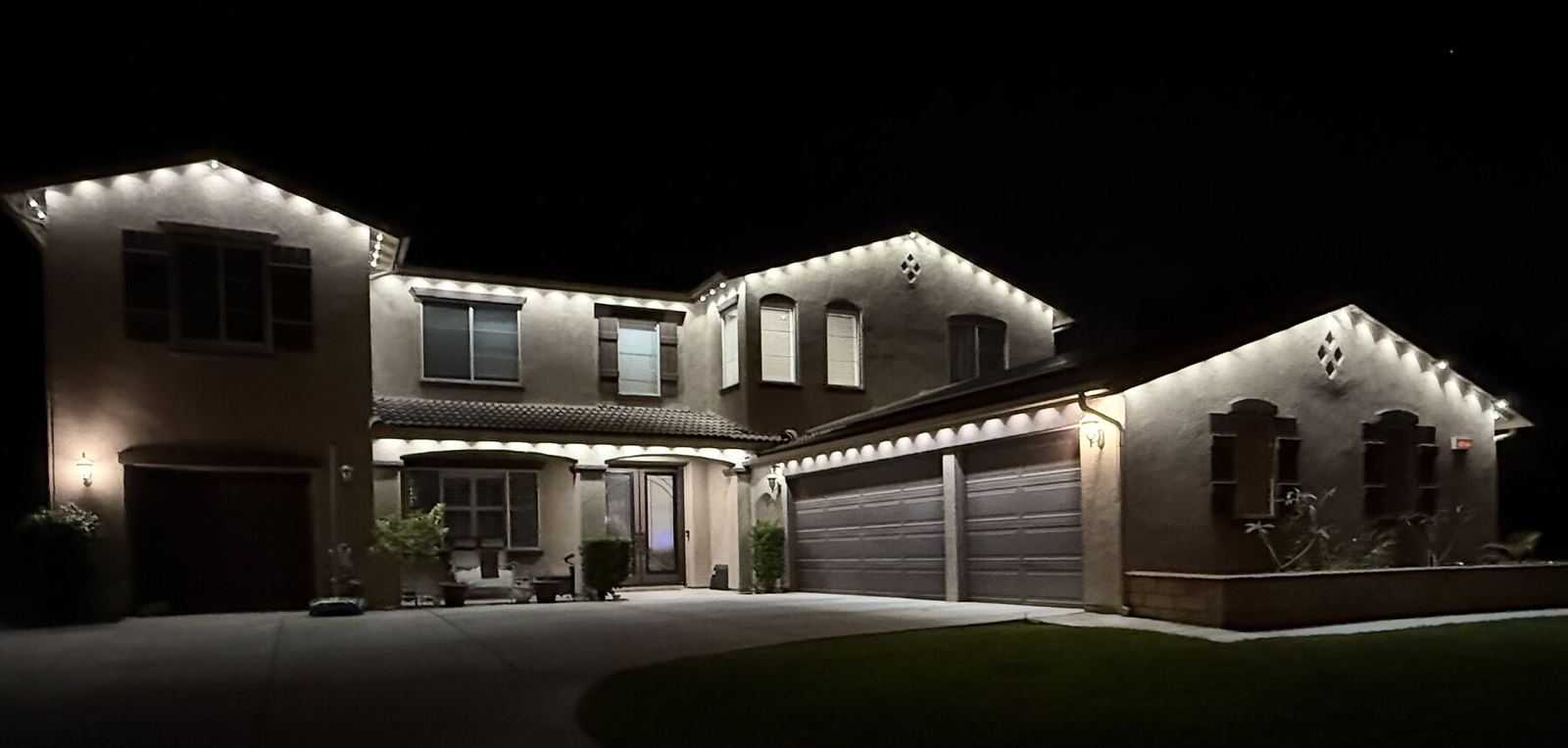 Two story warm white diamond gable — permanent LED roofline lighting in Riverside, CA