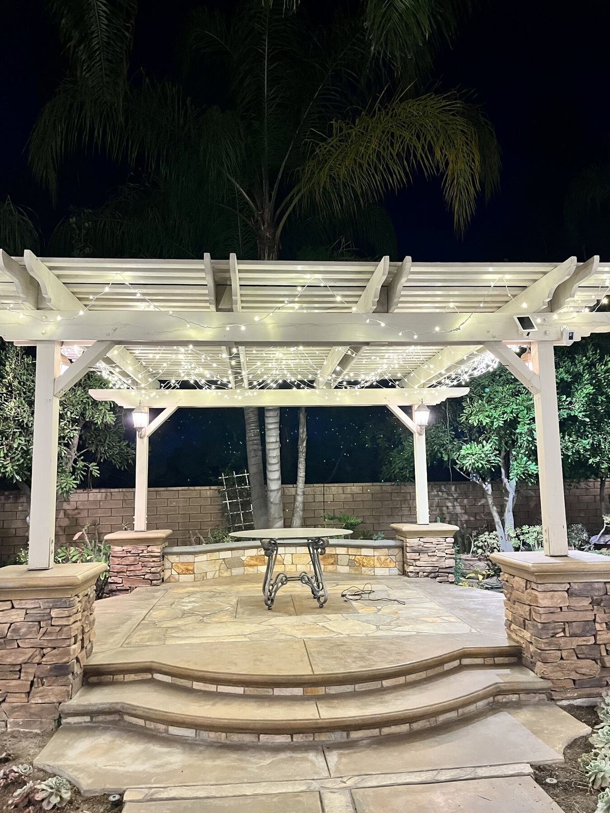 Pergola table night — bistro & string lighting install in Riverside, CA