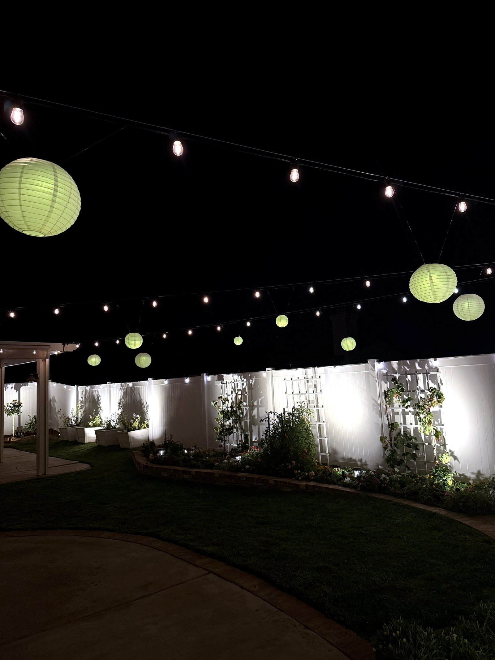 Lanterns backyard garden night — bistro & string lighting install in Riverside, CA
